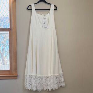 Elegant White Dress with Lace Hem